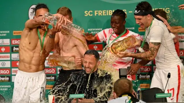 Beer shower for coach Domenico Tedesco, RasenBallsport Leipzig, during the press conference, RB Leipzig wins the DFB Cup final, 79th DFB Cup final