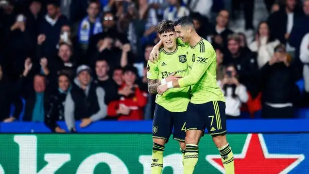 Alejandro Garnacho and Cristiano Ronaldo embrace for Manchester United.