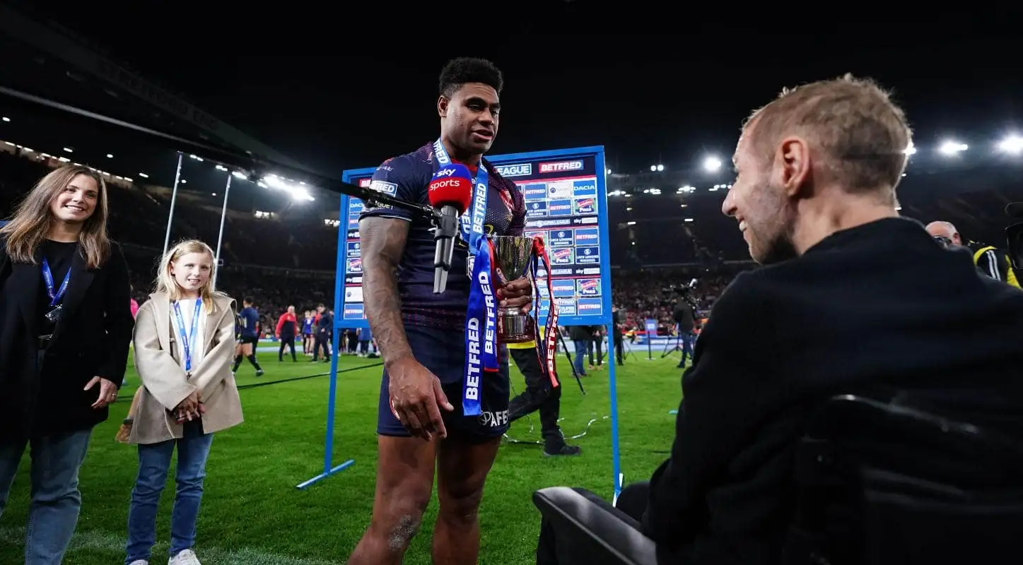 Kevin Naiqama of St Helens being presented the Harry Sunderland Trophy by Rob Burrow