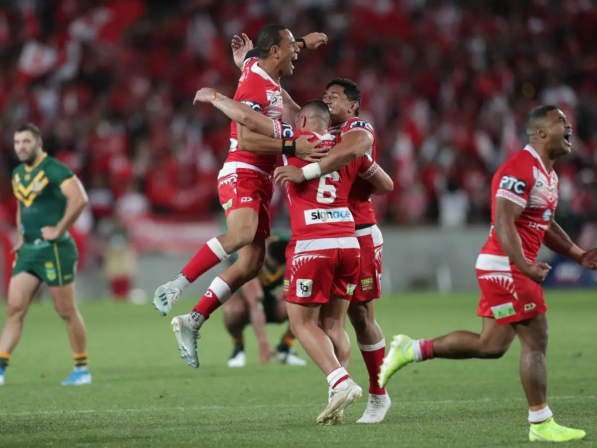 Tonga players celebrate beating Australia PA