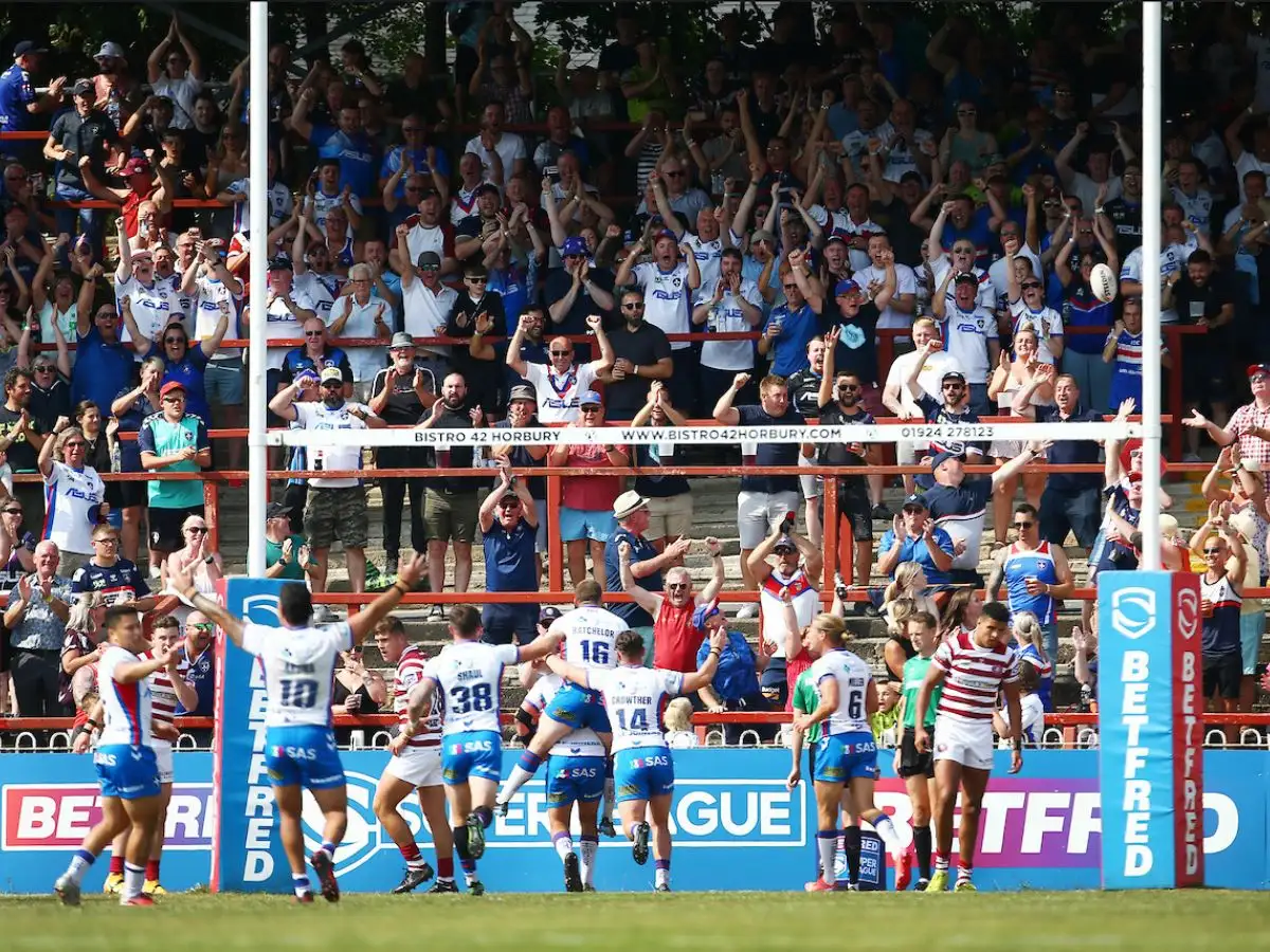 Wakefield Trinity players celebrate with fans Belle Vue SWpix