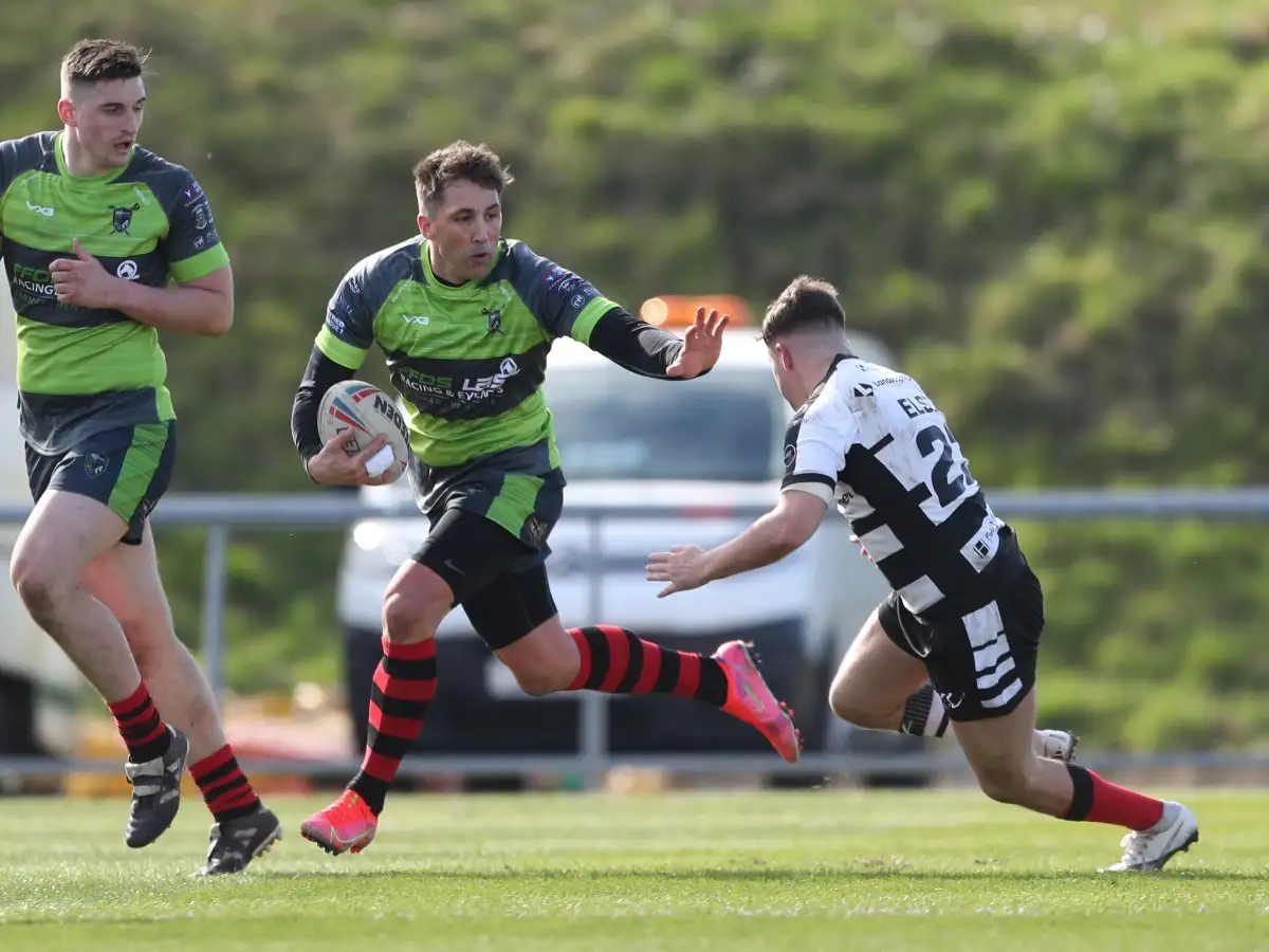 Lewis Else tackles Gavin Henson during West Wales Raiders v Widnes during 2021 Challenge Cup