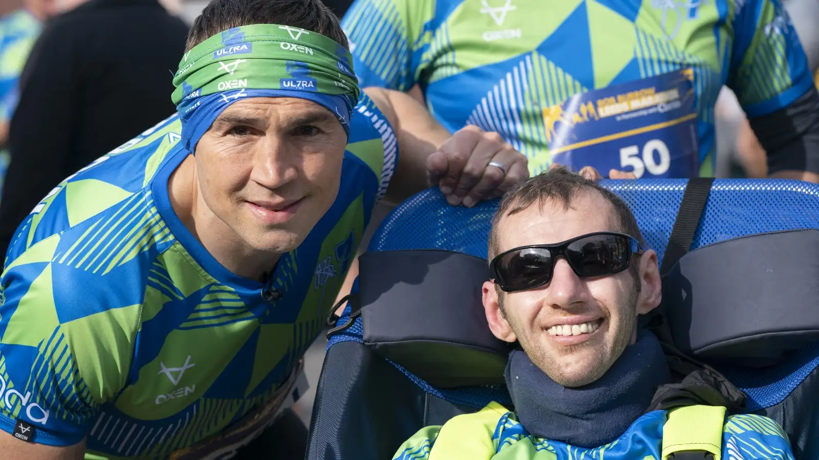 Photos: The amazing moment incredible Kevin Sinfield carries inspirational Rob Burrow over marathon finish line