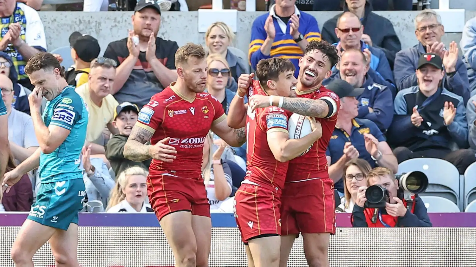 Catalans Dragons Arthur Mourgue celebrates with Arthur Romano at Magic Weekend.