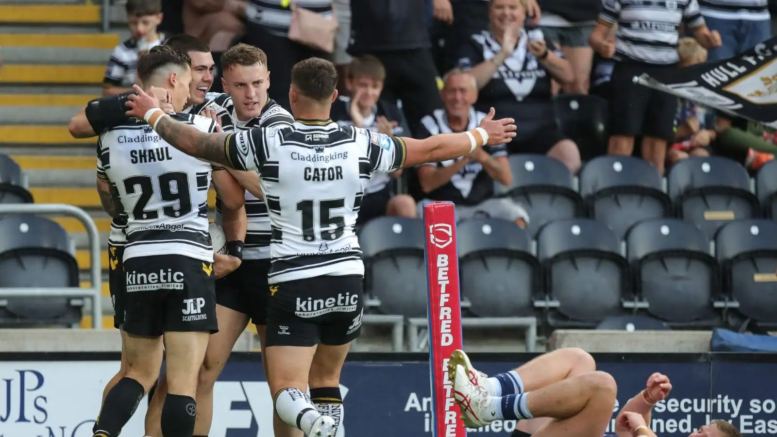 Jake Clifford celebrates his try against St Helens with team-mates. Photo by James Heaton/News Images.