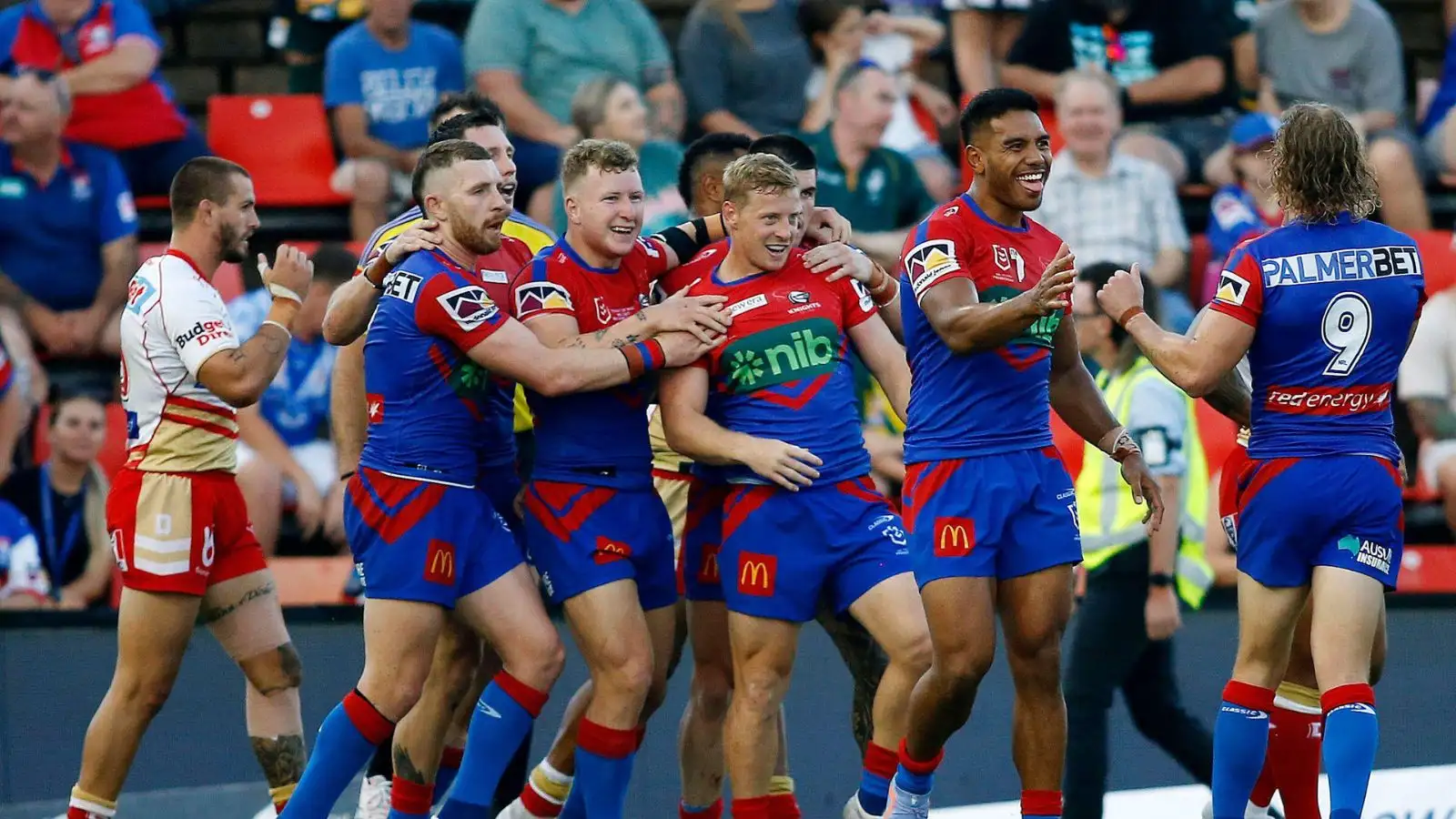Lachlan Miller celebrates with his Newcastle Knights team-mates against Dolphins in the NRL. Photo by AAP Image/Darren Pateman.