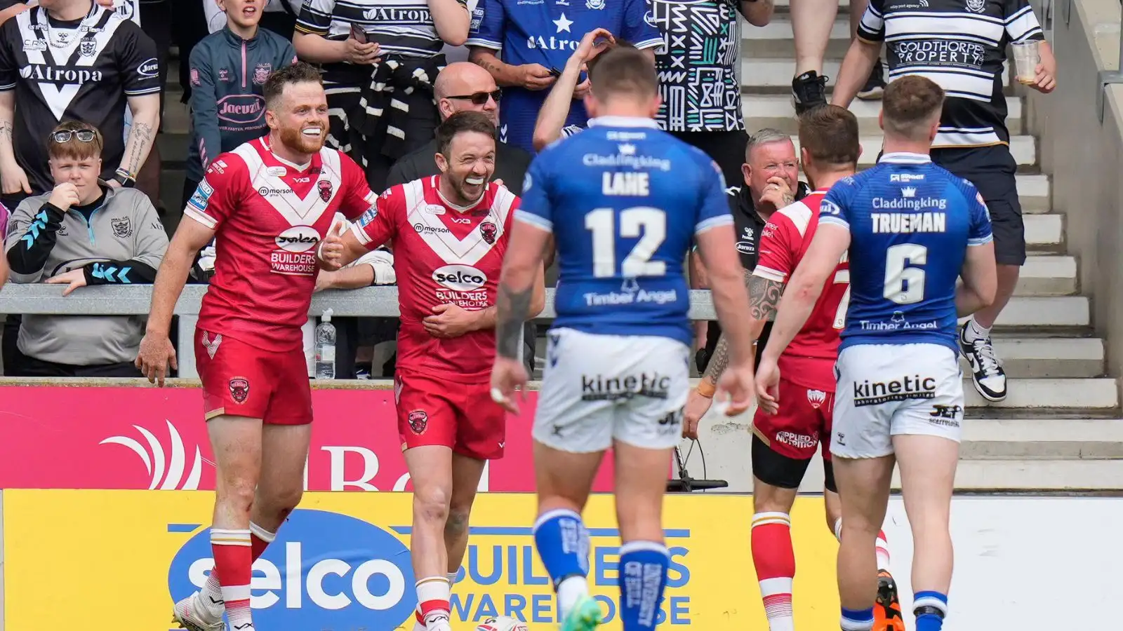 Ryan Brierley celebrates with Joe Burgess against Hull FC. Photo by Steve Flynn/News Images.