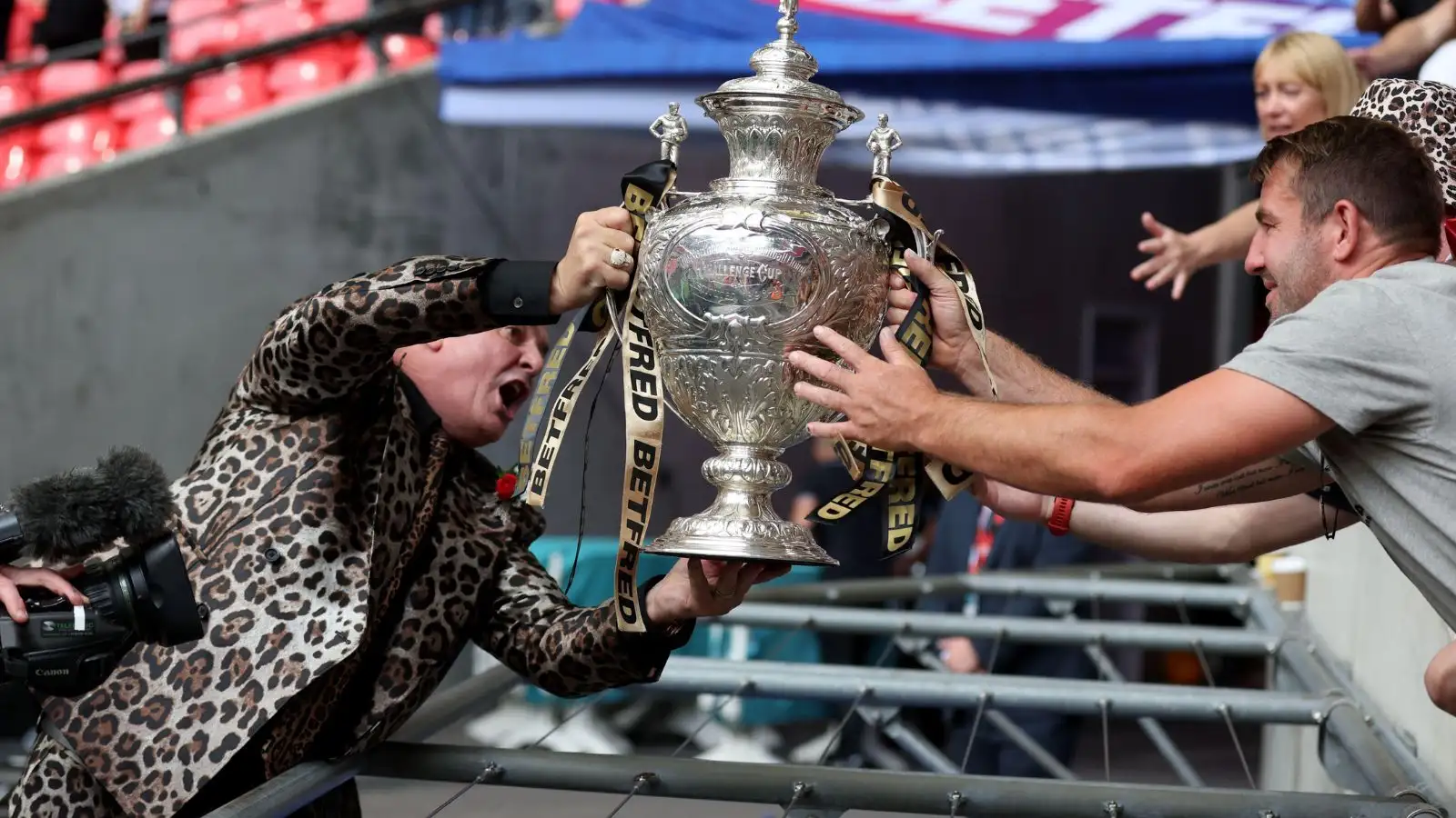 Derek Beaumont hands the Challenge Cup to Martyn Ridyard