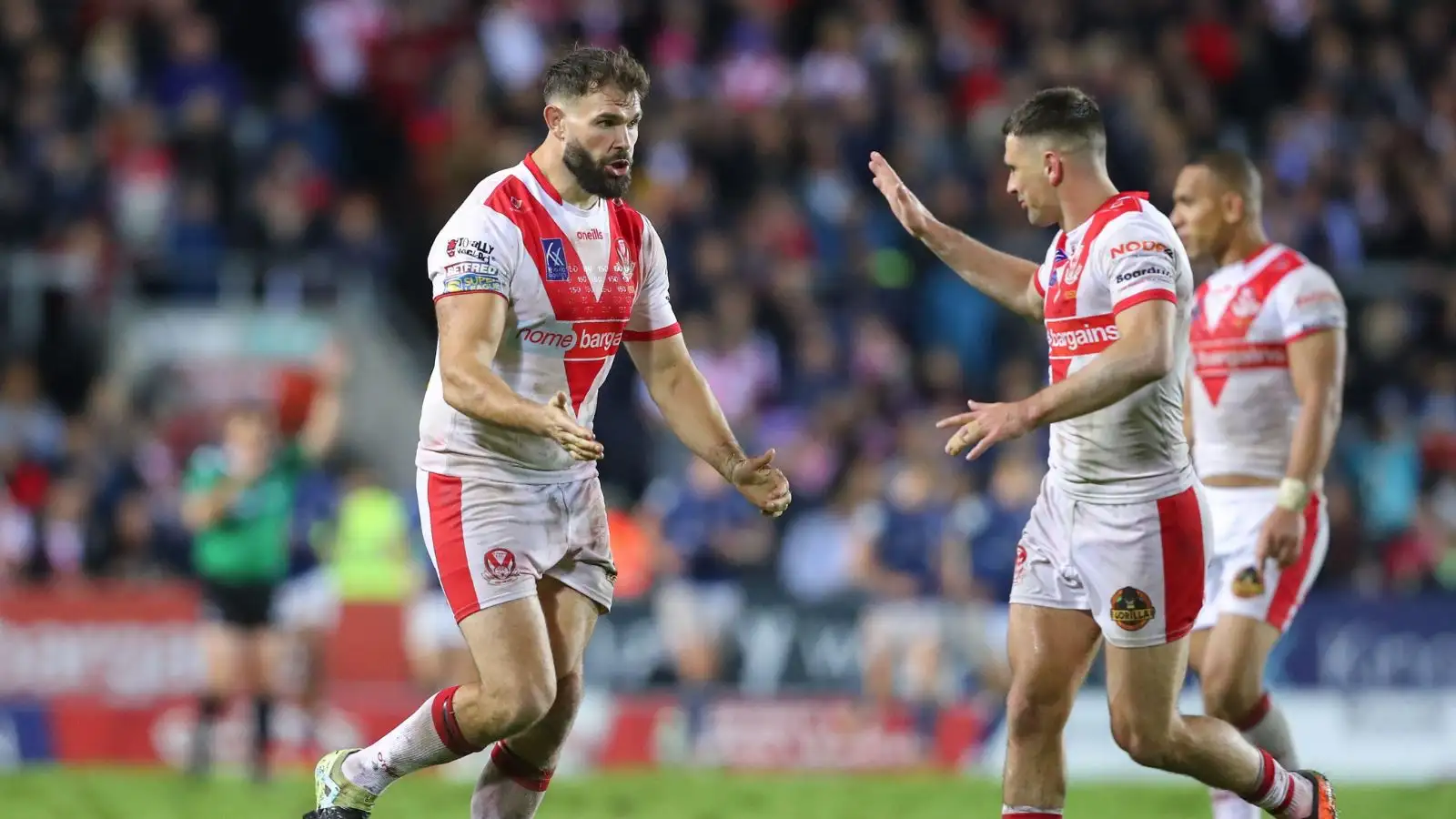 St Helens' Alex Walmsley high fives team-mate Lewis Dodd.