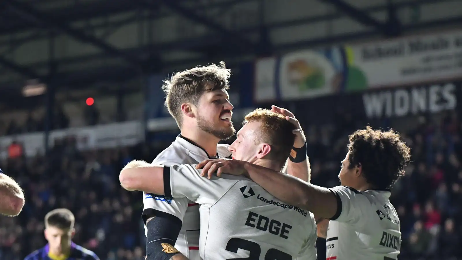 Adam Lawton, Joe Edge and Kieran Dixon celebrate a try against Halifax Panthers.