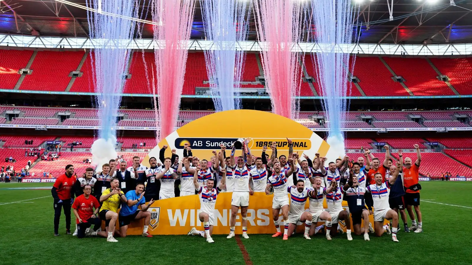 Wakefield Trinity lift 1895 Cup on pitch at Wembley, 2024