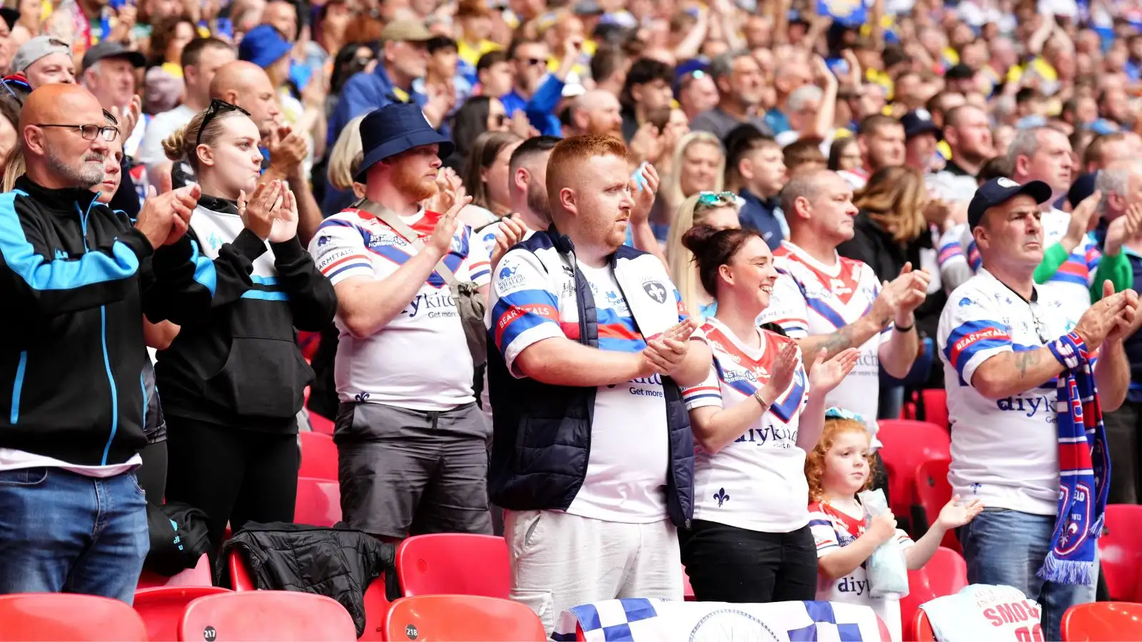 Wakefield Trinity supporters applaud in memory of Rob Burrow