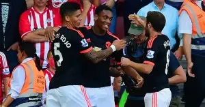 Anthony Martial (c): Celebrates his goal with Marcos Rojo and fellow scorer Juan Mata