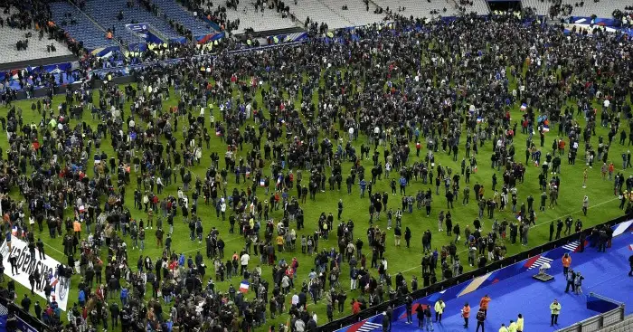 Stade de France: Fans on pitch following terror attacks