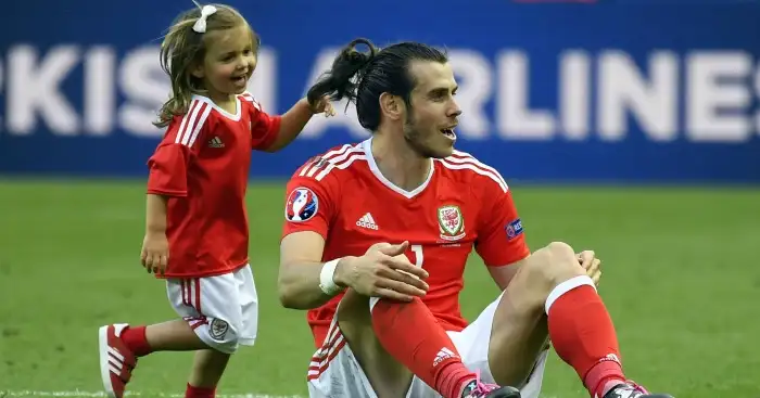 Gareth Bale: Celebrates with his daughter at full-time