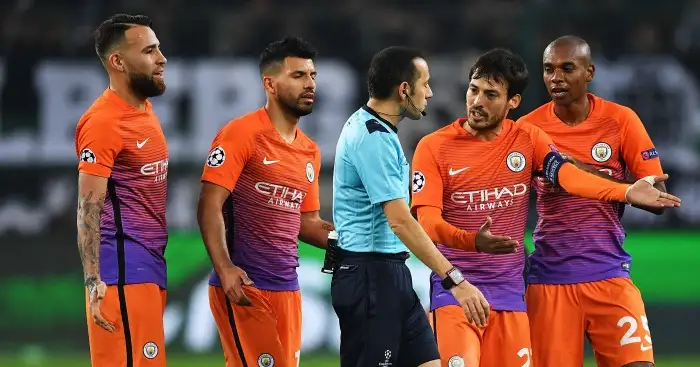 Unhappy: Man City players contest red card