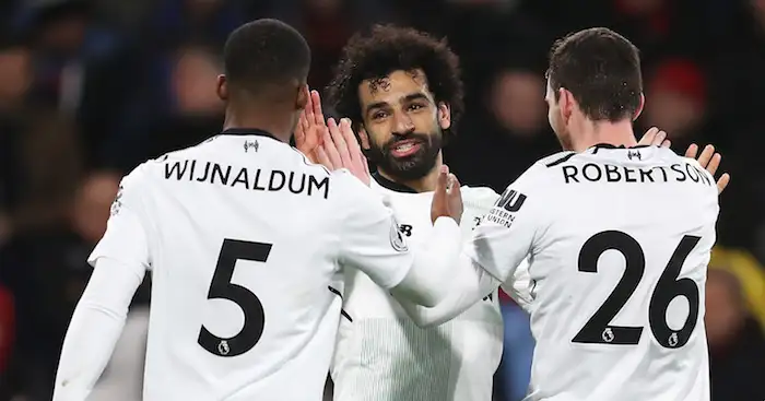 BOURNEMOUTH, ENGLAND - DECEMBER 17: Mohamed Salah of Liverpool celebrates with teammates Georginio Wijnaldum and Andy Robertson after scoring his sides third goal during the Premier League match between AFC Bournemouth and Liverpool at Vitality Stadium on December 17, 2017 in Bournemouth, England. (Photo by Catherine Ivill/Getty Images)