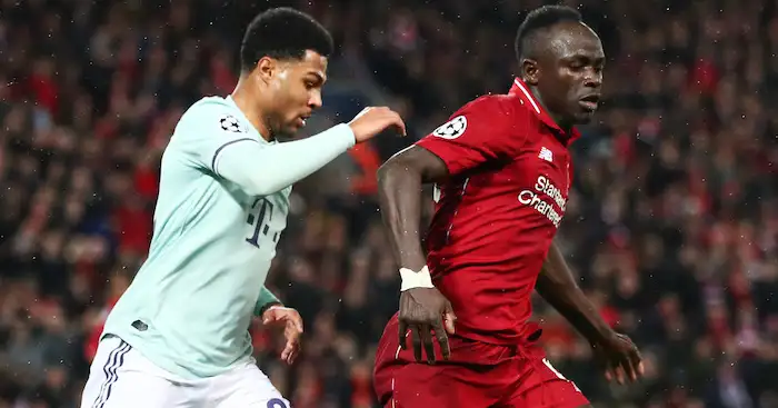 LIVERPOOL, ENGLAND - FEBRUARY 19: Sadio Mane of Liverpool battles with Serge Gnabry of Bayern Munich during the UEFA Champions League Round of 16 First Leg match between Liverpool and FC Bayern Muenchen at Anfield on February 19, 2019 in Liverpool, England. (Photo by Clive Brunskill/Getty Images)