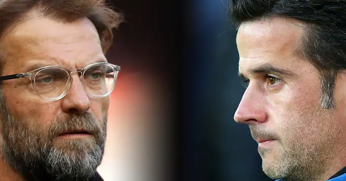 FILE PHOTO (EDITORS NOTE: COMPOSITE OF IMAGES - Image numbers 946221366,1025073120 - GRADIENT ADDED) In this composite image a comparison has been made between Jurgen Klopp, Manager of Liverpool (L) and Marco Silva, Manager of Everton. Liverpool FC and Everton FC meet in the Merseyside derby at Anfield on December 2, 2018 in Liverpool. ***LEFT IMAGE*** LIVERPOOL, ENGLAND - APRIL 14: Jurgen Klopp, Manager of Liverpool looks on during the warm up prior to the Premier League match between Liverpool and AFC Bournemouth at Anfield on April 14, 2018 in Liverpool, England. (Photo by Clive Brunskill/Getty Images) ***RIGHT IMAGE*** LIVERPOOL, ENGLAND - AUGUST 29: Marco Silva, Manager of Everton looks on prior to the Carabao Cup Second Round match between Everton and Rotherham United at Goodison Park on August 29, 2018 in Liverpool, England. (Photo by Alex Livesey/Getty Images)