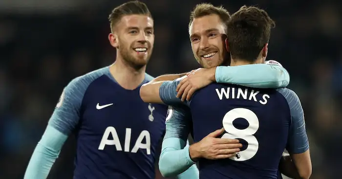 Tottenham Hotspur's English midfielder Harry Winks (R) celebrates with Tottenham Hotspur's Danish midfielder Christian Eriksen (C) and Tottenham Hotspur's Belgian defender Toby Alderweireld (L) on the pitch after the English Premier League football match between Fulham and Tottenham Hotspur at Craven Cottage in London on January 20, 2019. - Tottenham won the game 2-1. (Photo by Adrian DENNIS / AFP) / RESTRICTED TO EDITORIAL USE. No use with unauthorized audio, video, data, fixture lists, club/league logos or 'live' services. Online in-match use limited to 120 images. An additional 40 images may be used in extra time. No video emulation. Social media in-match use limited to 120 images. An additional 40 images may be used in extra time. No use in betting publications, games or single club/league/player publications. / (Photo credit should read ADRIAN DENNIS/AFP/Getty Images)