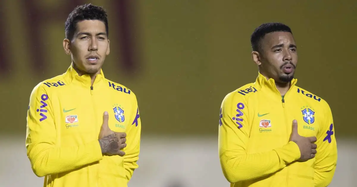 Roberto Firmino and Gabriel Jesus lining up for the Brazil national anthem