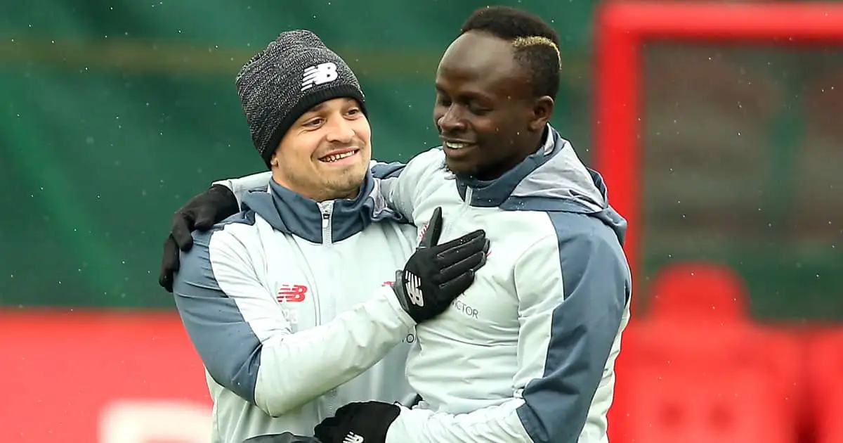 Xherdan Shaqiri embracing Sadio Mane in Liverpool training, 2019