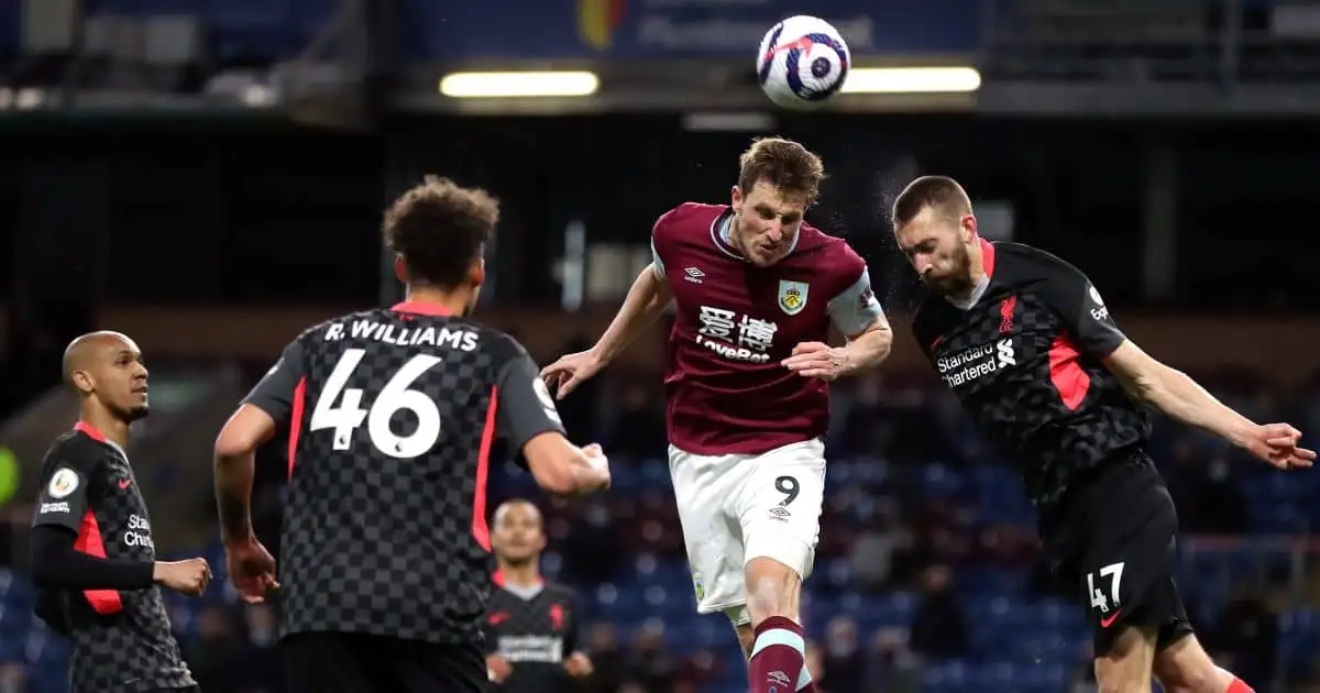 Liverpool's Nathaniel Phillips competes with Burnley's Chris Wood