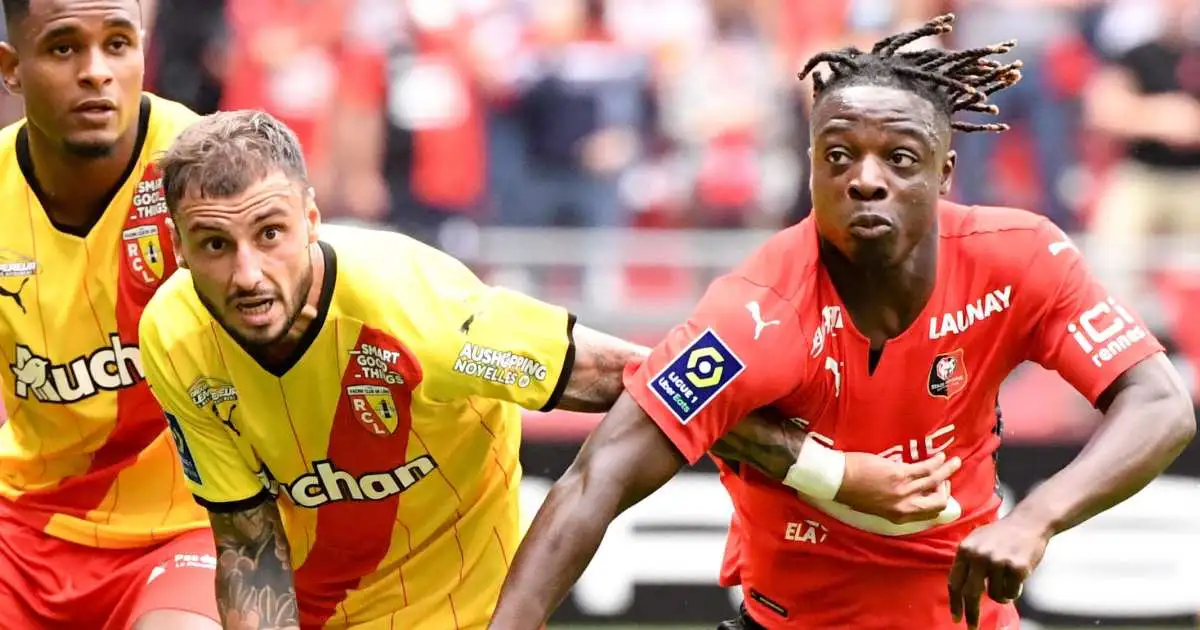 Jonathan Clauss of Lens tussles with Jeremy Doku of Rennes