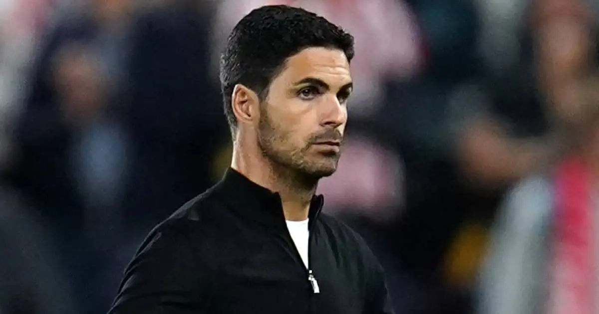 Arsenal manager Mikel Arteta walking across the pitch after losing 2-0 to Brentford