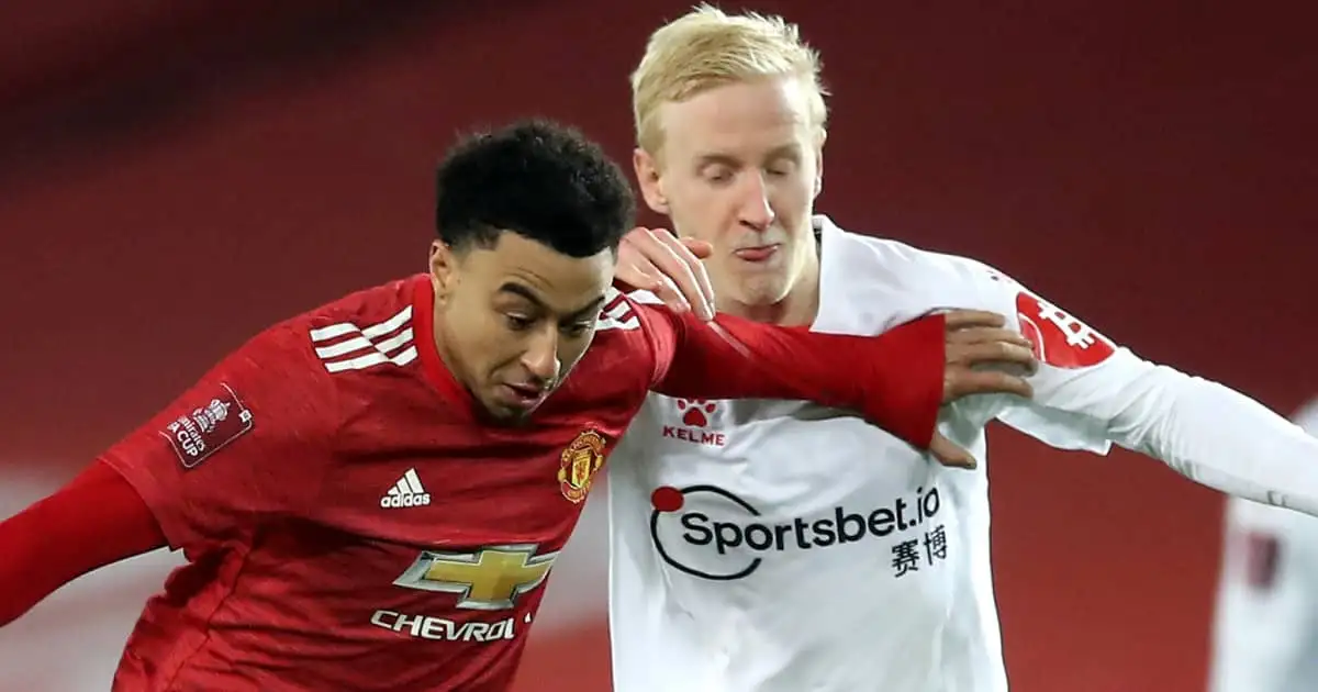 Man Utd winger Jesse Lingard tussling with Watford midfielder Will Hughes 2021