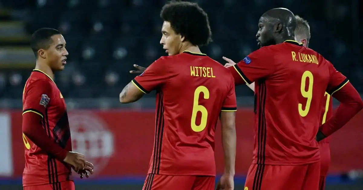 Axel Witsel, Youri Tielemans and Romelu Lukaku chatting whilst playing for Belgium in 2021