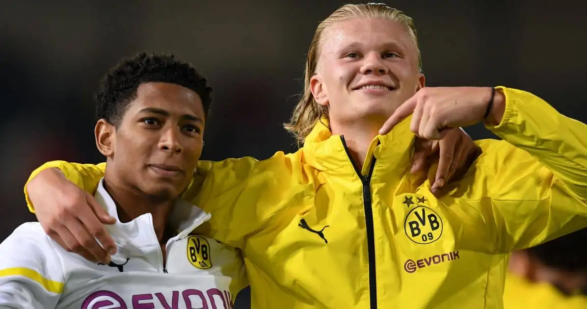 Borussia Dortmund's triple scorer Erling Haaland (r) and Jude Bellingham celebrate in front of the fan block after the 3:0 victory