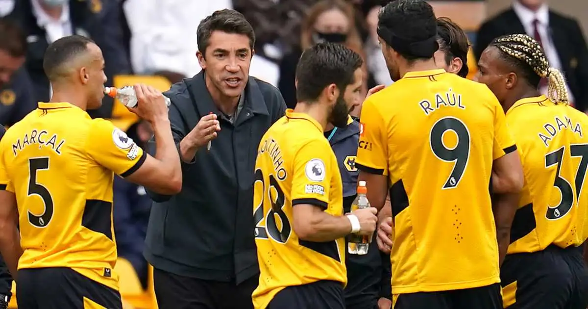 Bruno Lage speaks to his Wolves players on the touchline, August 2021
