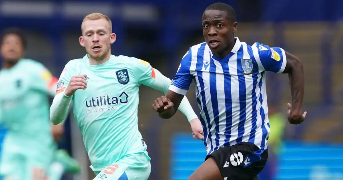 Sheffield Wednesday's Dennis Adeniran and Huddersfield Town's Lewis O'Brien battle for the ball during the Carabao Cup first round match at Hillsborough