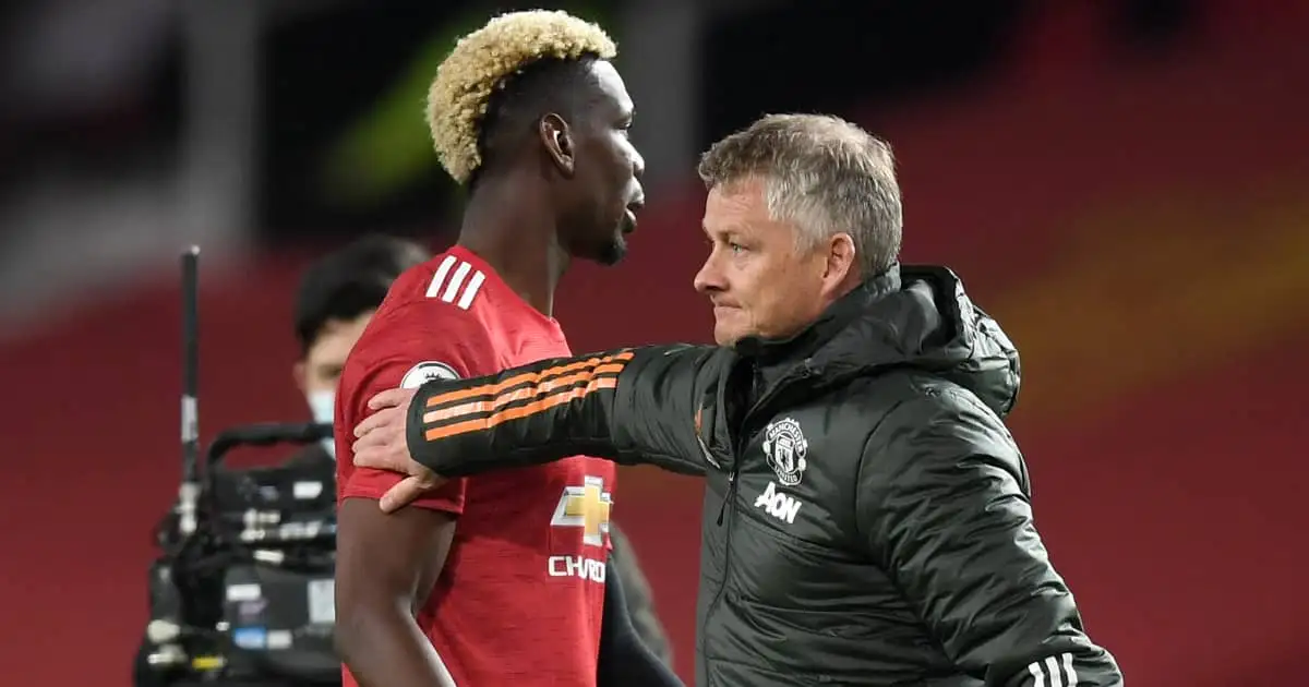 Man Utd midfielder Paul Pogba being patted on the shoulder by manager Ole Gunnar Solskjaer in 2021