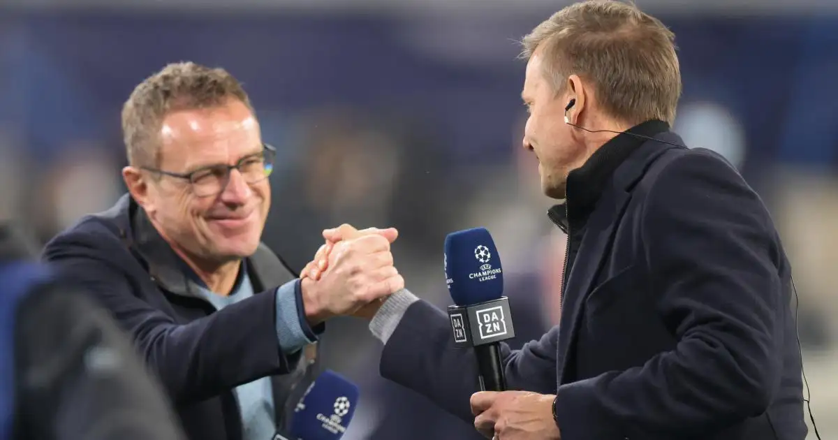 Ralf Rangnick shakes hands with RB Leipzig manager Jesse Marsch during coverage of a Champions League match, 2021