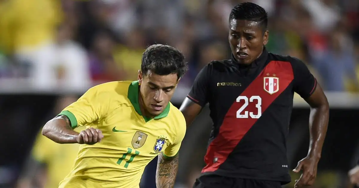 Phillipe Coutinho of Brazil and Pedro Aquino of Peru battle for the ball in a 2019 friendly