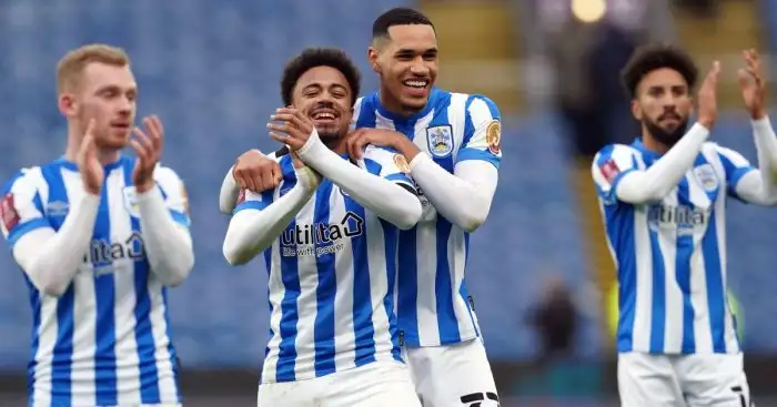 Huddersfield Town's Josh Koroma (left) celebrates with Jonathan Russell following the Emirates FA Cup third round match at Turf Moor