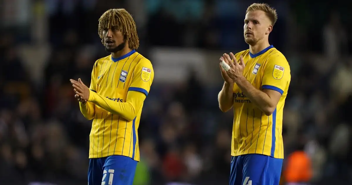Birmingham City's Dion Sanderson (left) and Birmingham City's Marc Roberts applaud the fans after the Sky Bet Championship match at The Den