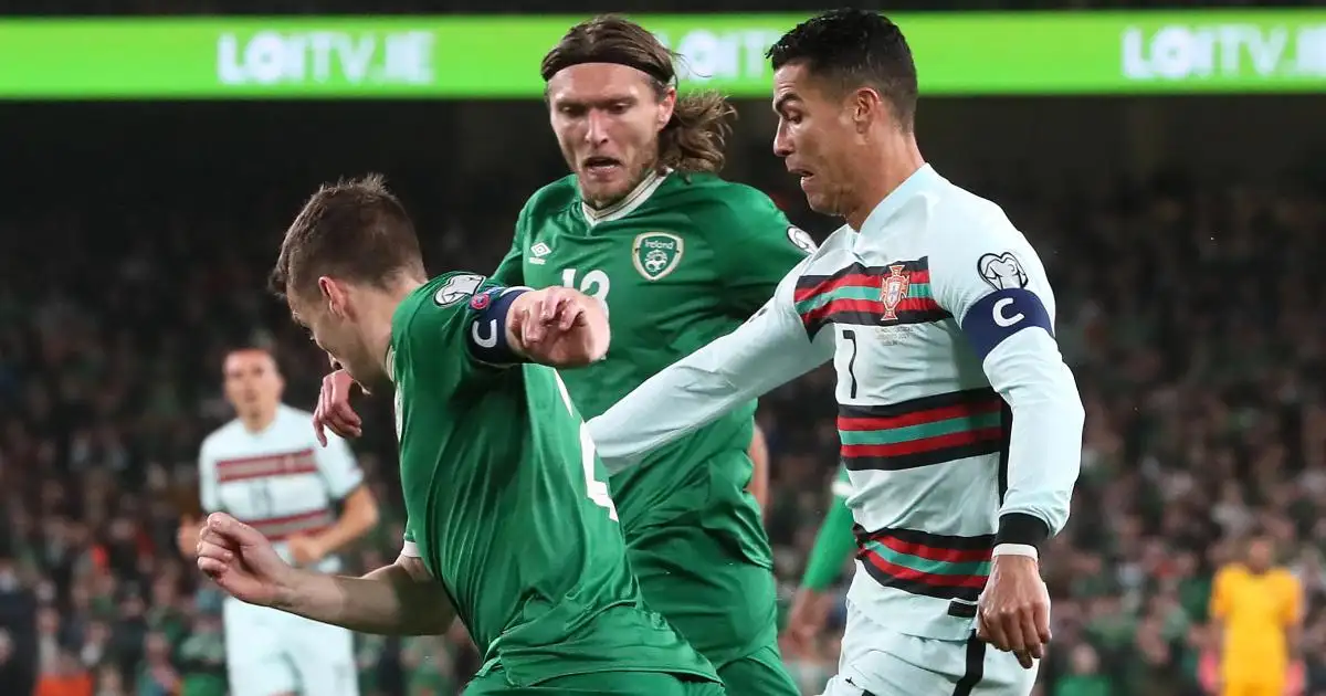 Ireland's Jeff Hendrick and Seamus Coleman look to crowd out Portugal's Cristiano Ronaldo, November 2021