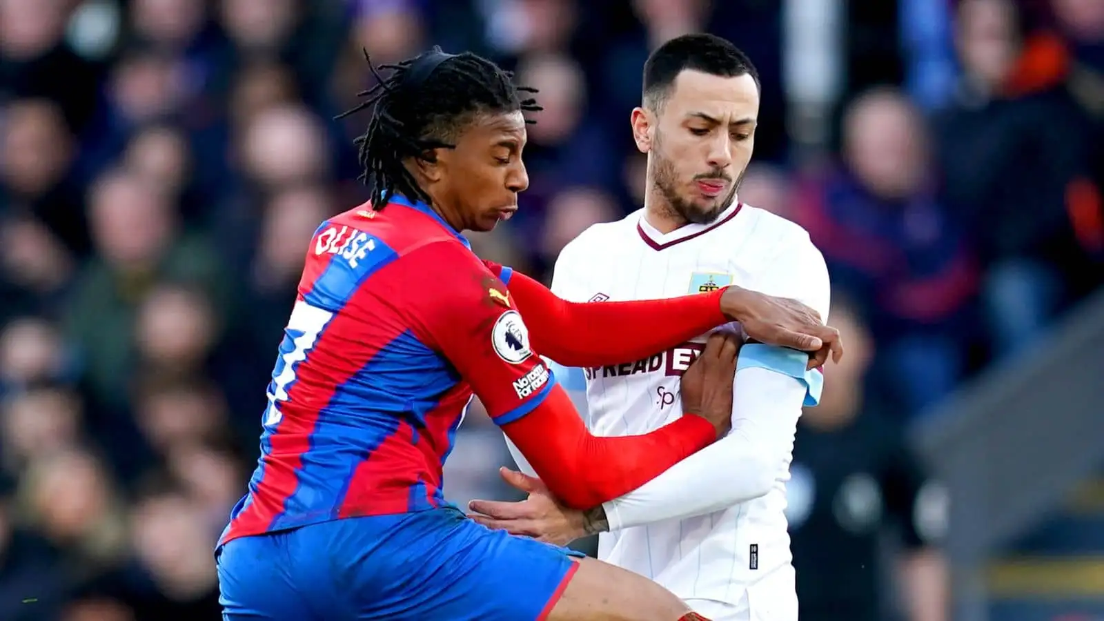 Michael Olise battles with Dwight McNeil during Crystal Palace v Burnley at Selhurst Park