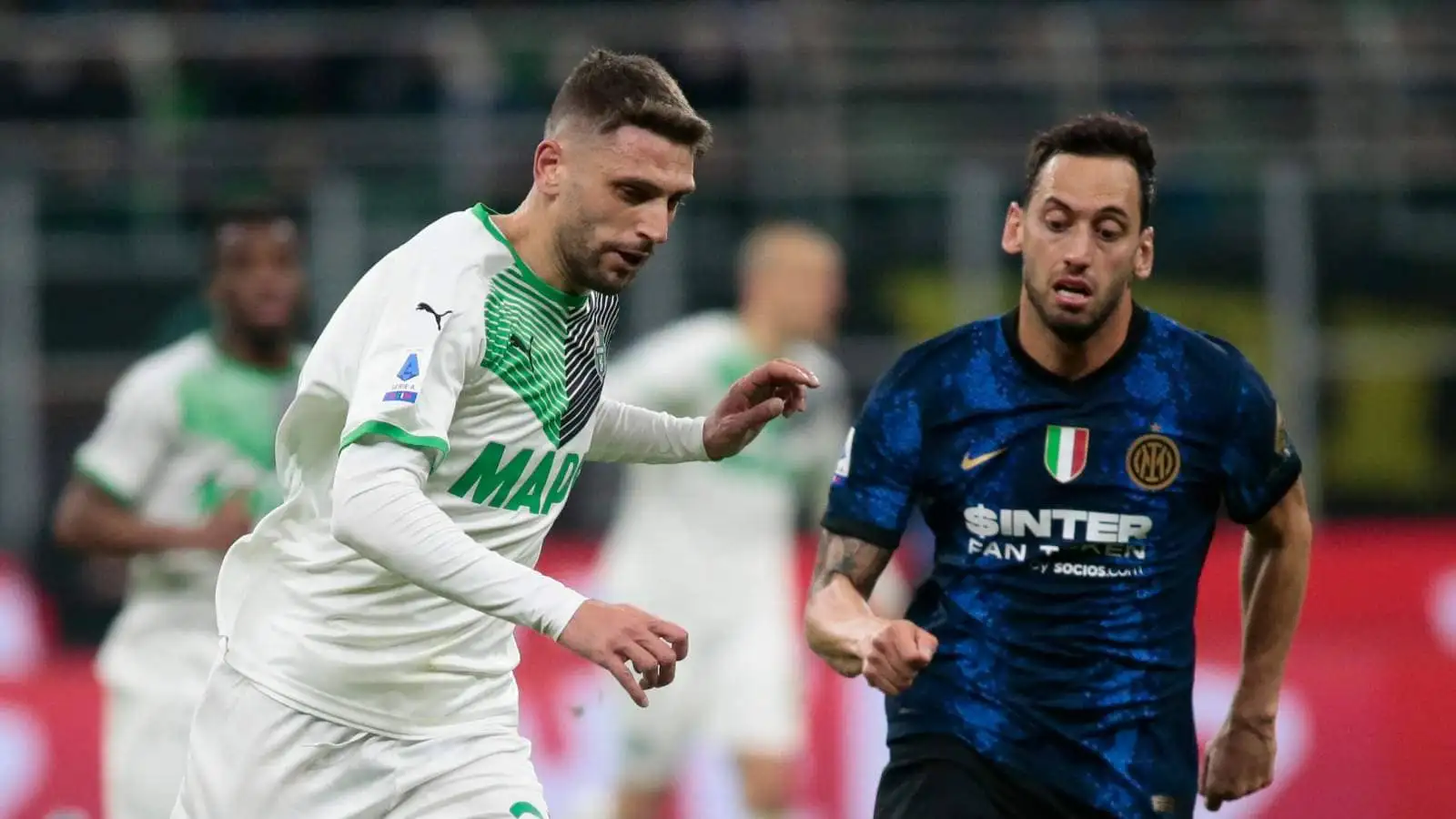 Domenico Berardi alongside Hakan Calhanoglu