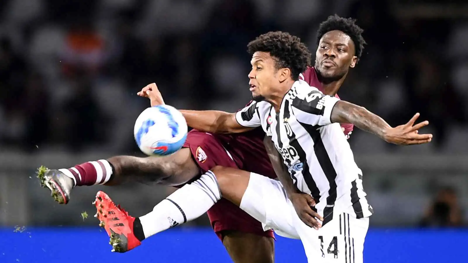 Ola Aina and Weston McKennie contest possession during Torino vs Juventus
