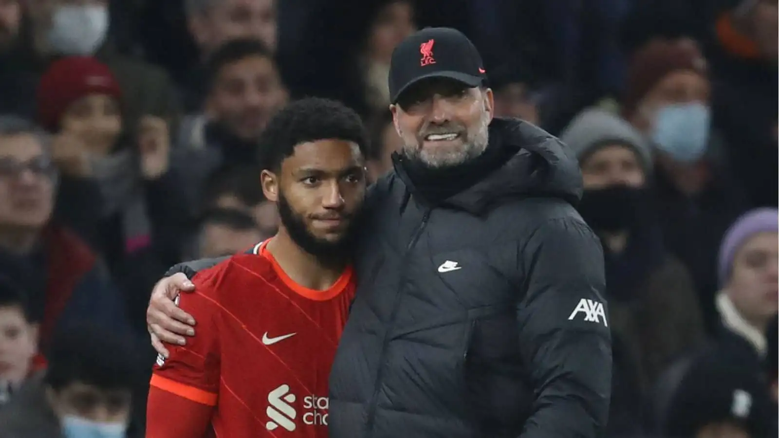 Liverpool manager Jurgen Klopp embracing centre-half Joe Gomez