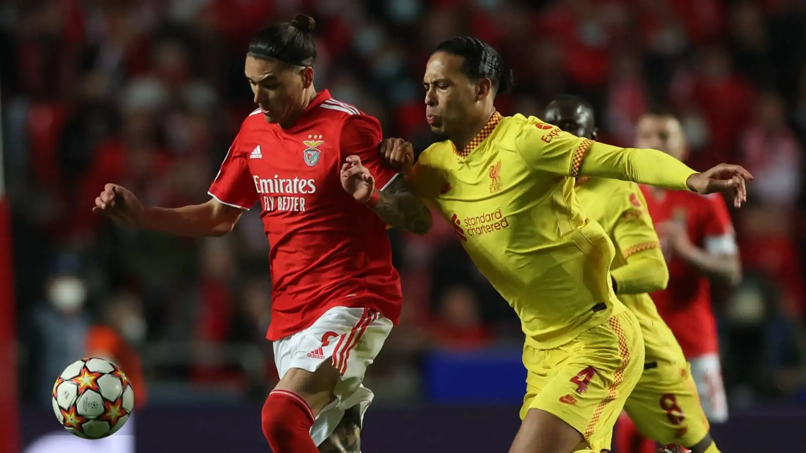 Benfica striker Darwin Nunez tussling with Liverpool defender Virgil van Dijk