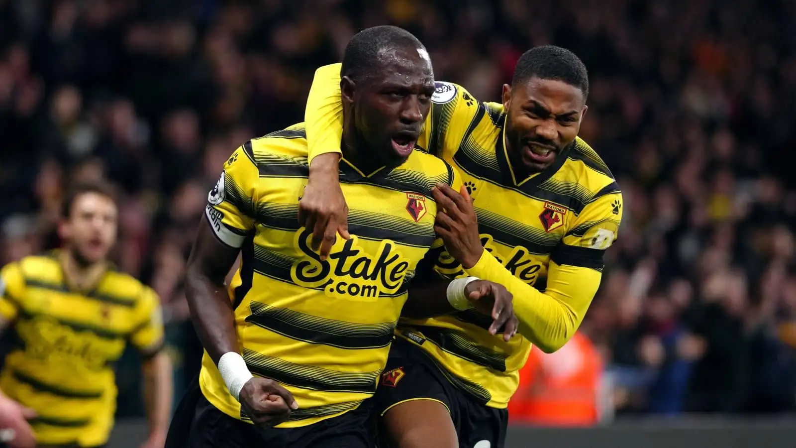 Moussa Sissoko and Emmanuel Dennis celebrate Watford goal in Premier League, February 2022