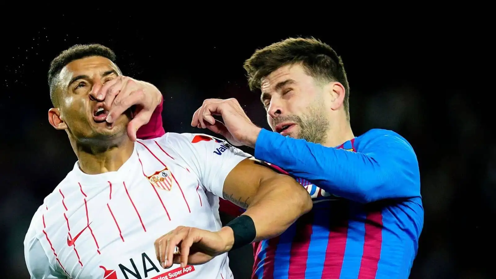 Gerard Pique of FC Barcelona and Diego Carlos of Sevilla FC during the La Liga match between FC Barcelona and Sevilla FC played at Camp Nou Stadium on April 3, 2022 in Barcelona, Spain