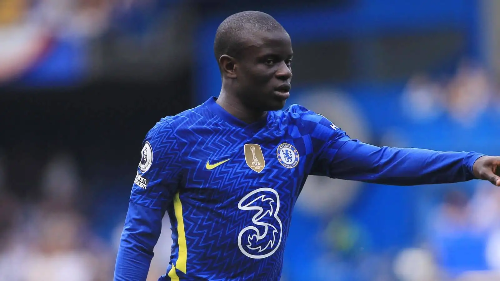 Chelsea midfielder N'Golo Kante stops for a chat and a photo with