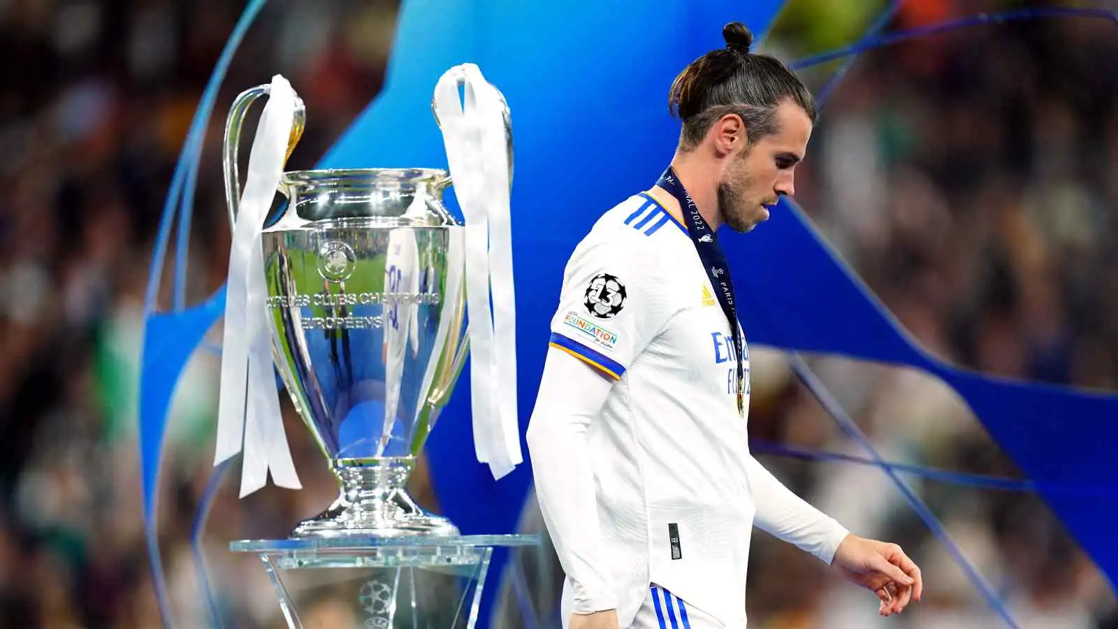 Gareth Bale walking away from the Champions League trophy