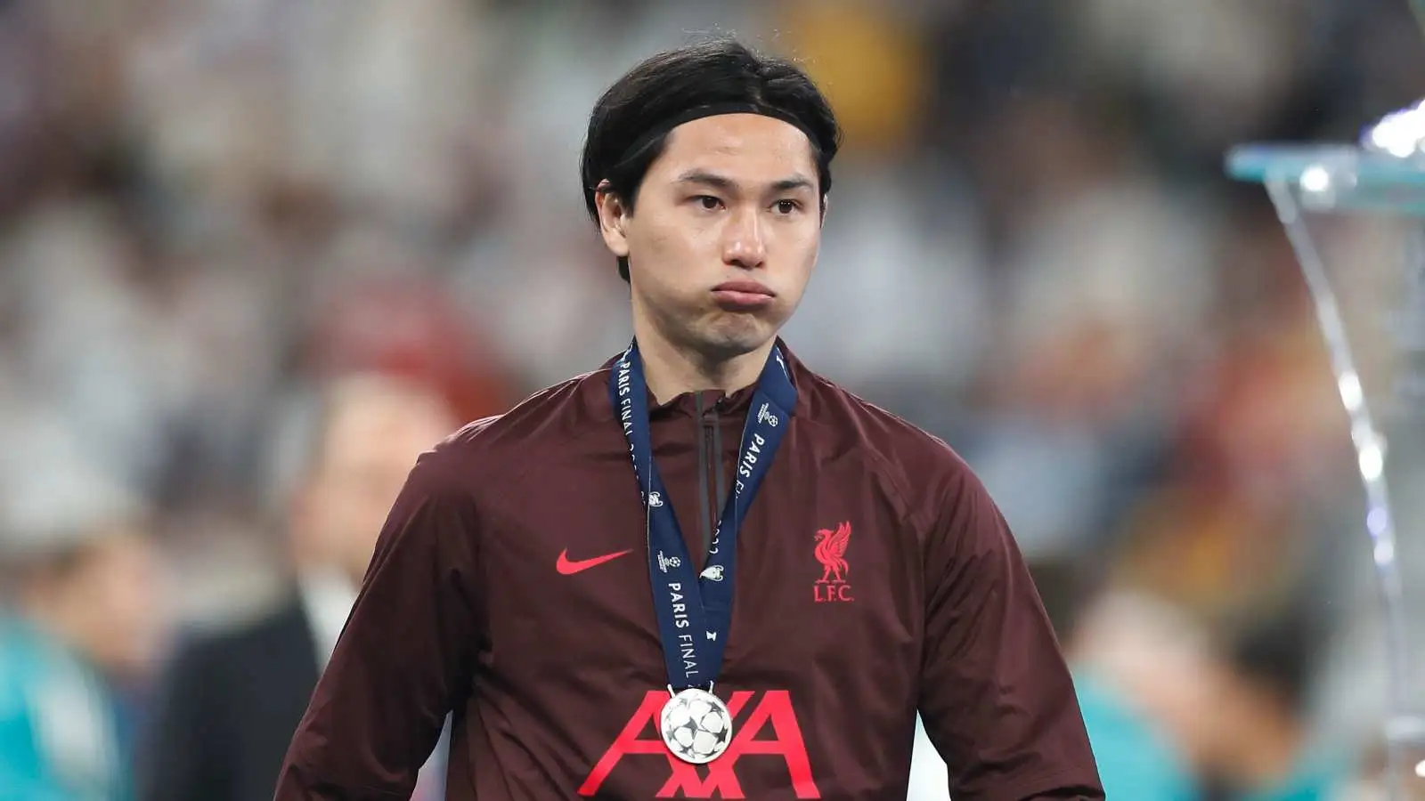 Takumi Minamino with a Champions League runners up medal